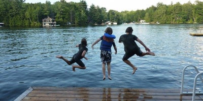 Family enjoying cottage dock on Lake Joseph