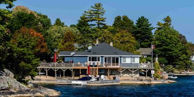 Cottage in Bay with dock and rock shoreline