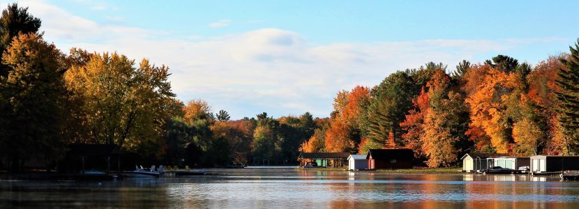 “Muskoka cottage on lakefront with brilliant autumn foliage”